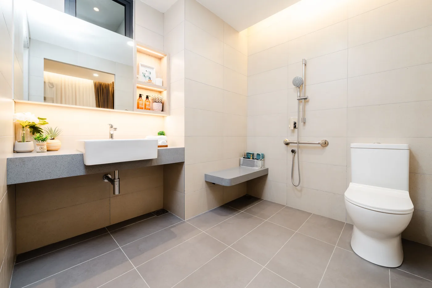 Accessible bathroom with grab rails and shower seat